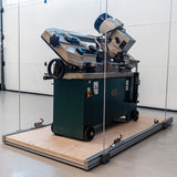 Garage attic lift system transporting heavy machinery securely on a sturdy platform.