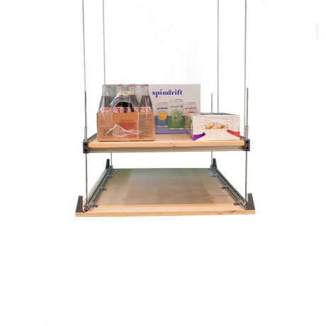 Attic storage lift system with shelves holding boxes and supplies, demonstrating convenient overhead storage for the garage.